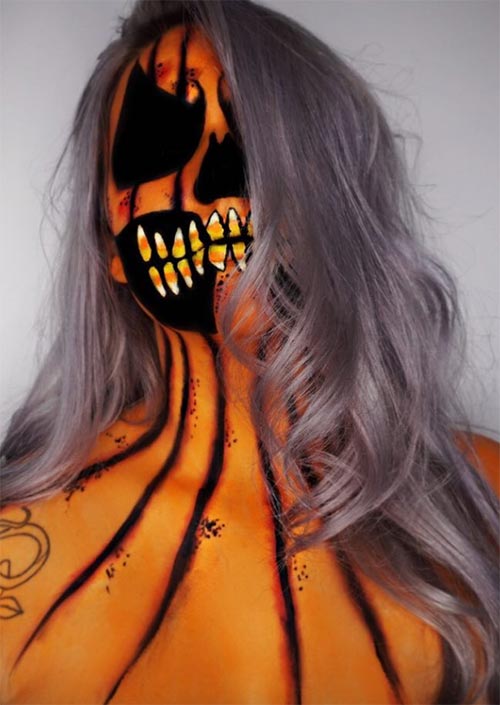 Terreur de citrouille : L'espace négatif est le meilleur atout pour cette idée de maquillage d'Halloween. Ça rend le regard terrifiant, alors que la mâchoire pleine de dents en sucre d'orge est un peu fantaisiste.